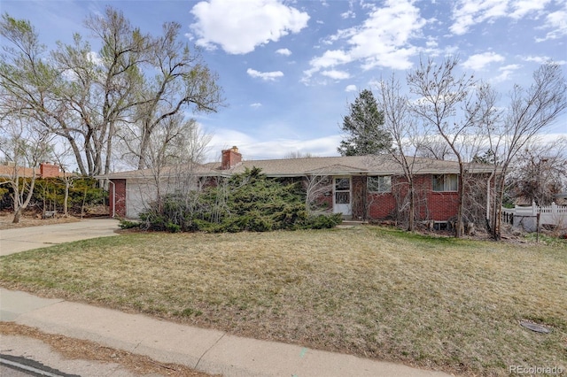 1720 S Balsam St, Lakewood, CO 80232 - ranch-style home featuring a chimney, concrete driveway, a front yard, and brick siding