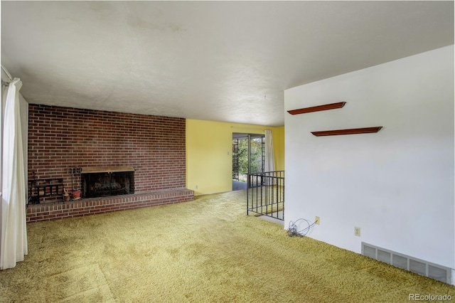 1720 S Balsam St, Lakewood, CO 80232 - unfurnished living room featuring carpet flooring, a brick fireplace, and visible vents