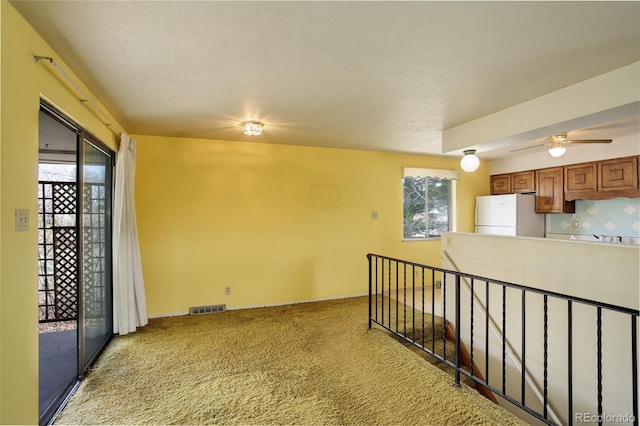 1720 S Balsam St, Lakewood, CO 80232 - carpeted spare room with a wealth of natural light, visible vents, baseboards, and a ceiling fan