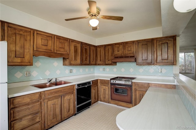 1720 S Balsam St, Lakewood, CO 80232 - kitchen with a sink, black dishwasher, under cabinet range hood, decorative backsplash, and oven