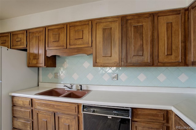 1720 S Balsam St, Lakewood, CO 80232 - kitchen featuring a sink, light countertops, black dishwasher, and brown cabinets