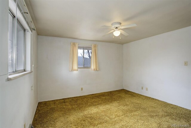 1720 S Balsam St, Lakewood, CO 80232 - empty room with a ceiling fan and carpet floors