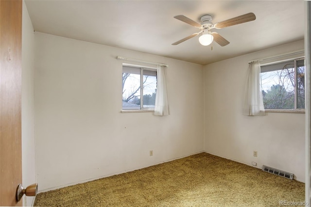 1720 S Balsam St, Lakewood, CO 80232 - empty room with a ceiling fan, a healthy amount of sunlight, carpet, and visible vents