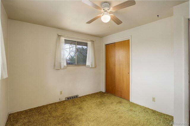 1720 S Balsam St, Lakewood, CO 80232 - unfurnished bedroom with visible vents, a ceiling fan, a closet, and carpet floors
