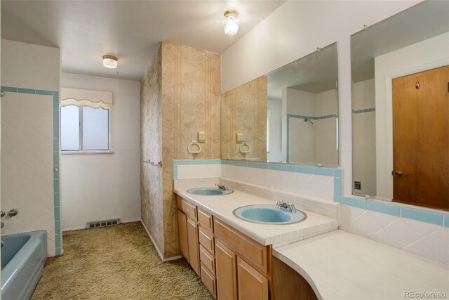 1720 S Balsam St, Lakewood, CO 80232 - full bath with double vanity, a sink, visible vents, and a washtub