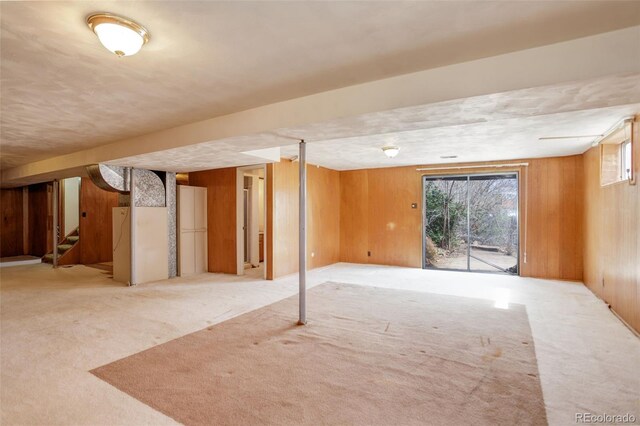 1720 S Balsam St, Lakewood, CO 80232 - basement featuring wood walls, carpet floors, and stairs