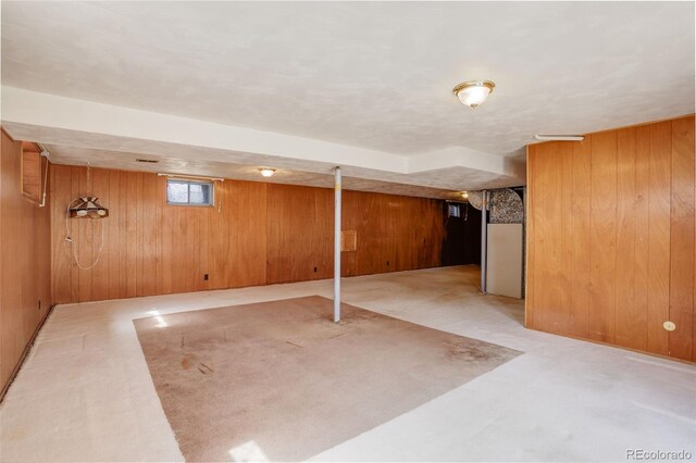 1720 S Balsam St, Lakewood, CO 80232 - basement with light carpet and wooden walls