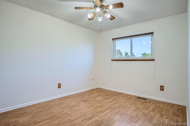 4664 S Zang St, Morrison, CO 80465 - spare room featuring a textured ceiling, light wood-style floors, and a ceiling fan