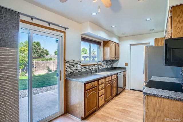 4664 S Zang St, Morrison, CO 80465 - kitchen featuring dark countertops, light wood-style flooring, backsplash, a ceiling fan, and recessed lighting