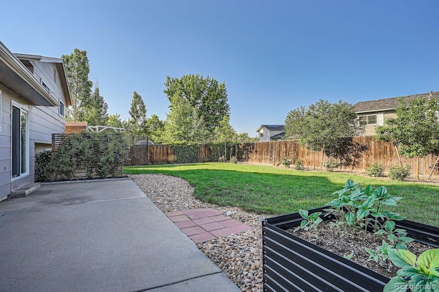 4664 S Zang St, Morrison, CO 80465 - fenced backyard with a patio area