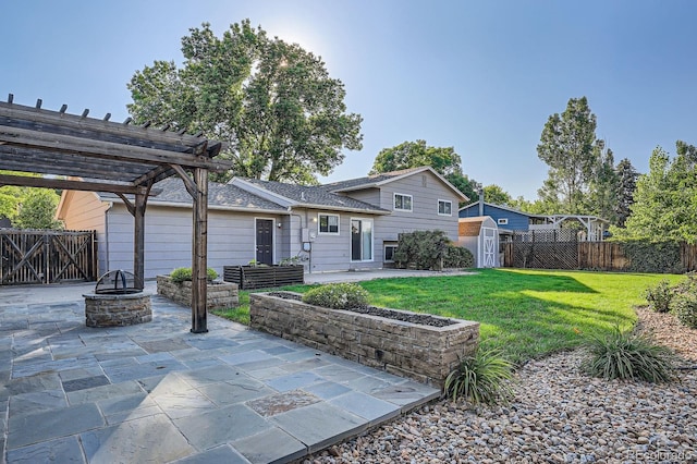 4664 S Zang St, Morrison, CO 80465 - rear view of house with an outdoor fire pit, a storage shed, a patio, a pergola, and a fenced backyard