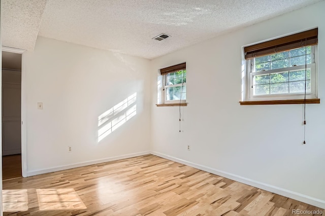4664 S Zang St, Morrison, CO 80465 - empty room with light wood-style flooring and a textured ceiling