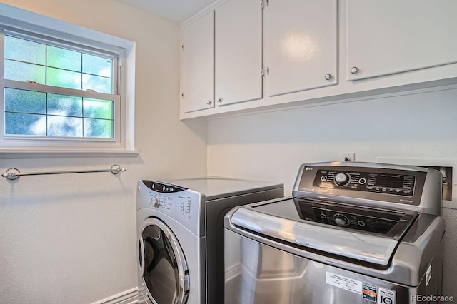 4664 S Zang St, Morrison, CO 80465 - laundry area featuring cabinet space and independent washer and dryer