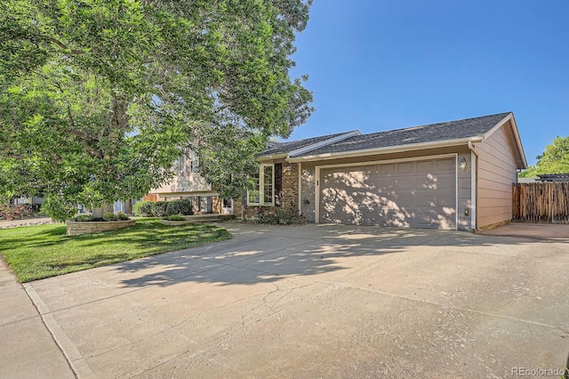 4664 S Zang St, Morrison, CO 80465 - view of front of property featuring driveway and a garage