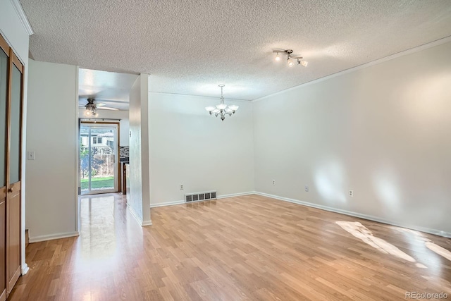 4664 S Zang St, Morrison, CO 80465 - unfurnished room with a textured ceiling, light wood-type flooring, a chandelier, ornamental molding, and a ceiling fan