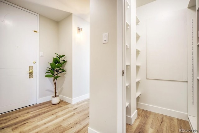 hall with light hardwood / wood-style flooring