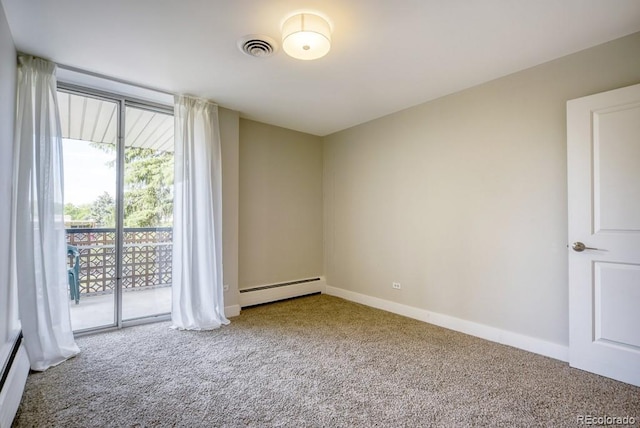 carpeted empty room featuring a baseboard radiator