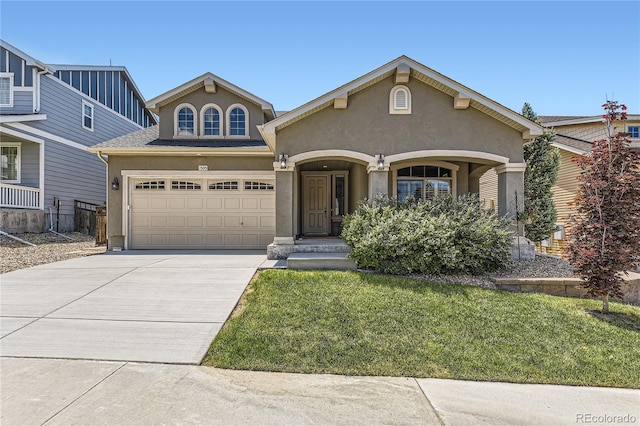 view of front facade with a front yard and a garage