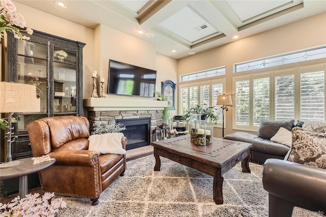 living room with a fireplace, beamed ceiling, and coffered ceiling