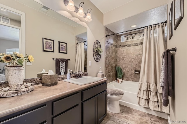 full bathroom featuring toilet, vanity, and shower / bath combo with shower curtain