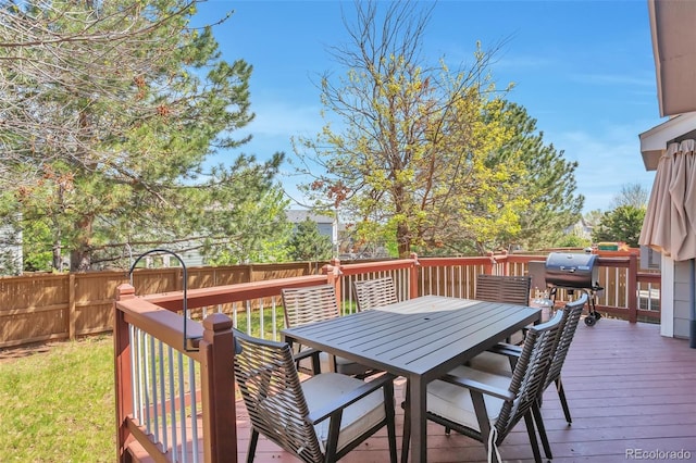 9889 Aftonwood St, Highlands Ranch, CO 80126 - wooden deck with a fenced backyard and outdoor dining area