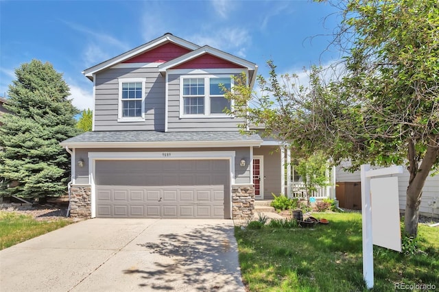 9889 Aftonwood St, Highlands Ranch, CO 80126 - craftsman-style home with an attached garage, stone siding, driveway, and roof with shingles
