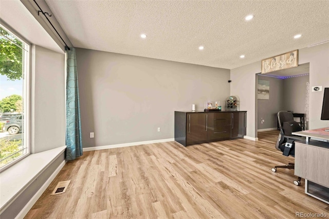 12234 W Saratoga Ave, Morrison, CO 80465 - home office with a textured ceiling, wood finished floors, and recessed lighting