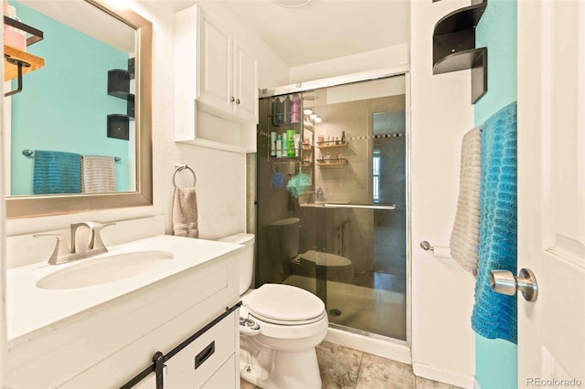 12234 W Saratoga Ave, Morrison, CO 80465 - full bathroom featuring a shower stall, vanity, and tile patterned floors