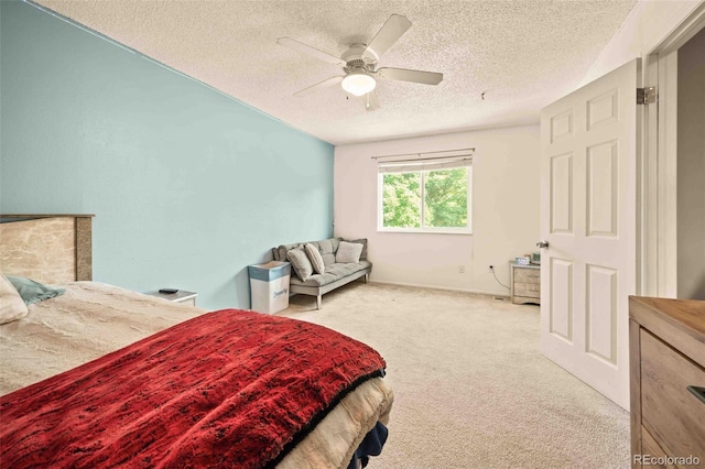 12234 W Saratoga Ave, Morrison, CO 80465 - bedroom with a textured ceiling, light carpet, and ceiling fan