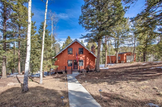 chalet / cabin featuring a chimney