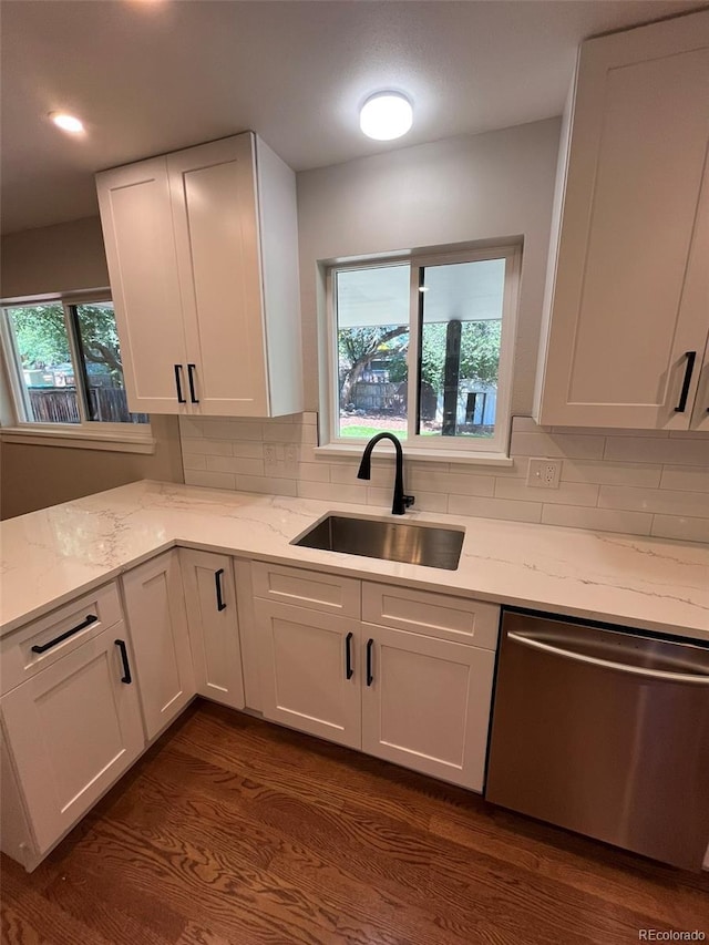 2836 S Fenton St, Denver, CO 80227 - kitchen with dishwasher, white cabinetry, and light stone counters