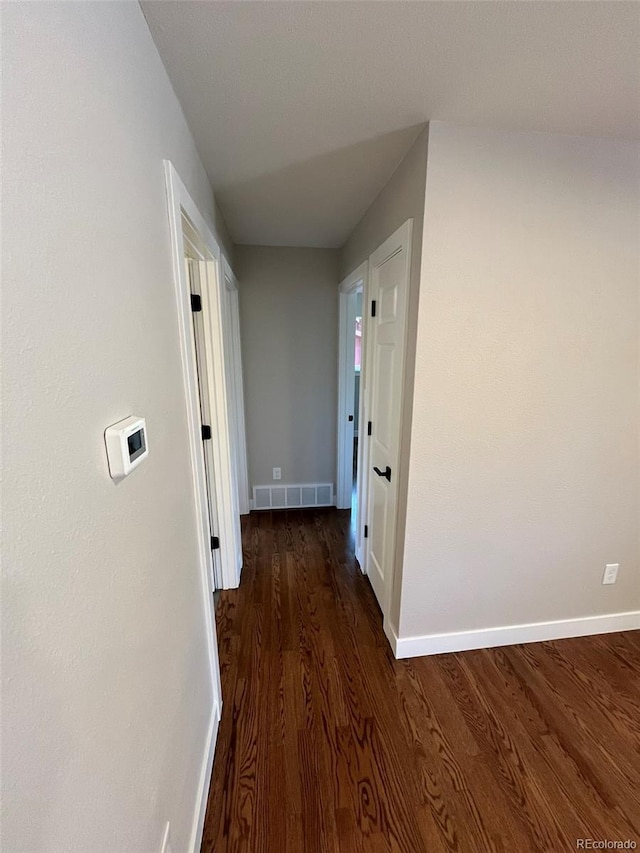 2836 S Fenton St, Denver, CO 80227 - hall with baseboards and wood finished floors