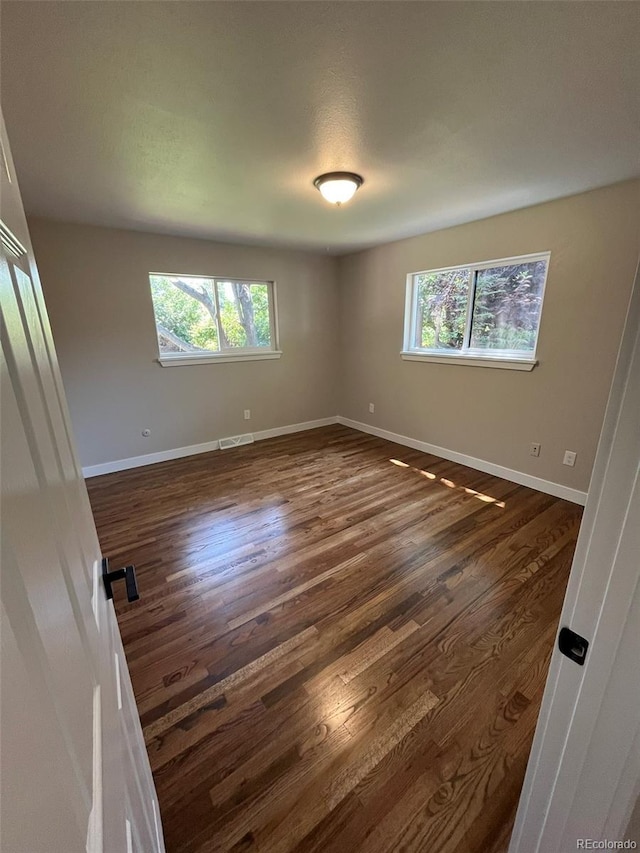 2836 S Fenton St, Denver, CO 80227 - spare room featuring dark wood-style floors and baseboards