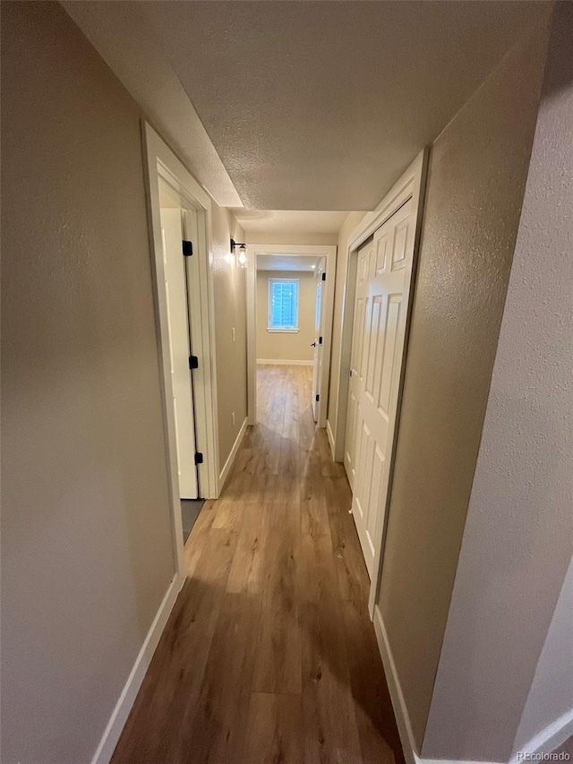 2836 S Fenton St, Denver, CO 80227 - hall featuring wood finished floors and baseboards