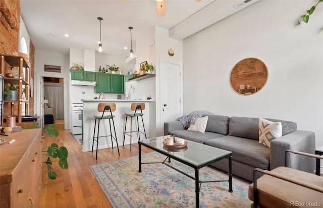 474 N Inca St, Denver, CO 80204 - living area with light wood-style floors and recessed lighting