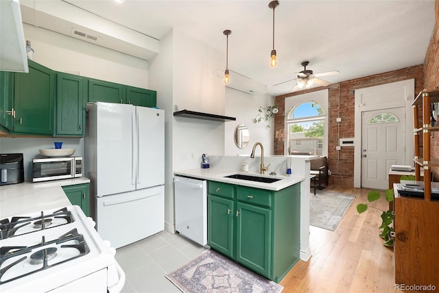 474 N Inca St, Denver, CO 80204 - kitchen with green cabinets, white appliances, brick wall, a ceiling fan, and light countertops