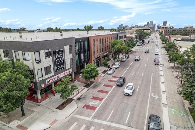 474 N Inca St, Denver, CO 80204 - view of property featuring uncovered parking and a city view