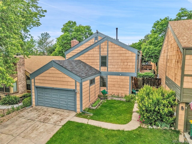 10222 W Ida Ave Unit 237, Littleton, CO 80127 - view of front facade featuring a chimney, driveway, an attached garage, and roof with shingles