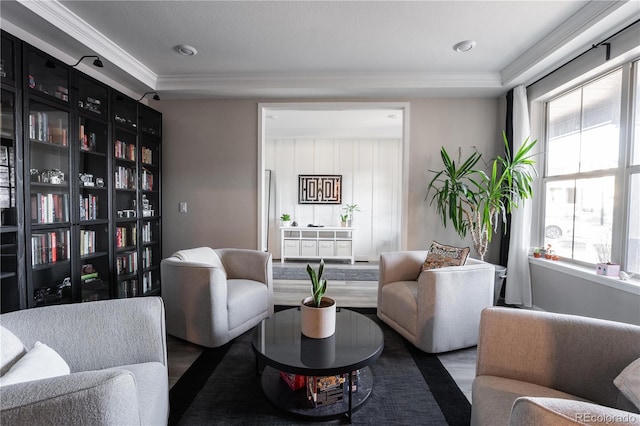 living room with dark wood-type flooring and ornamental molding