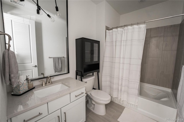 full bathroom with vanity, toilet, and shower / bath combo with shower curtain