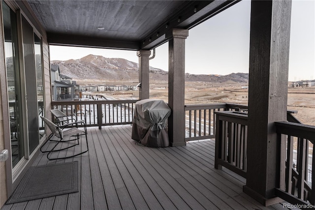 wooden deck featuring a mountain view