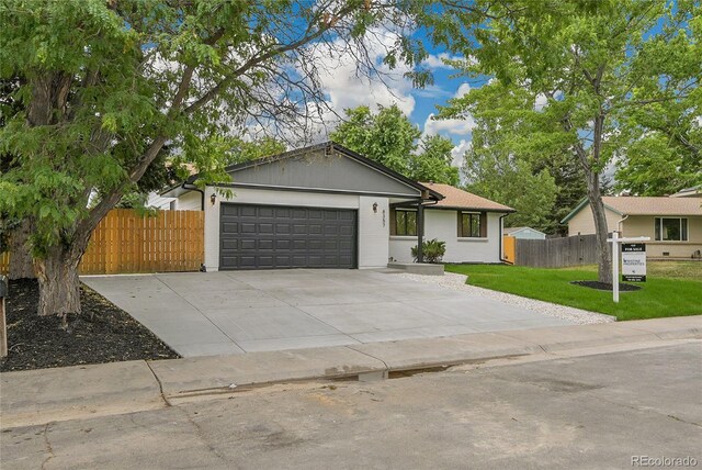 8357 Dudley Ct, Arvada, CO 80005 - single story home with a garage and driveway