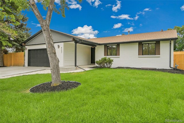 8357 Dudley Ct, Arvada, CO 80005 - single story home with a garage, driveway, and a shingled roof