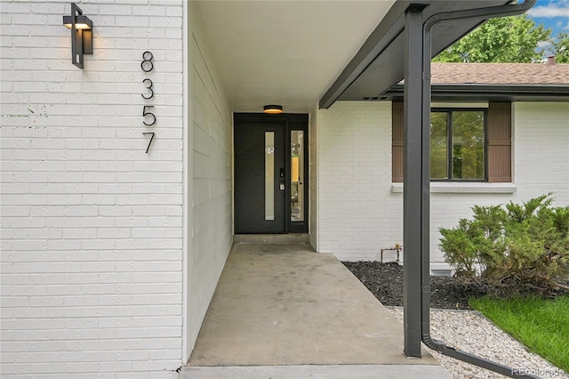 8357 Dudley Ct, Arvada, CO 80005 - property entrance with brick siding