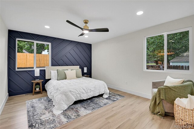 8357 Dudley Ct, Arvada, CO 80005 - bedroom featuring multiple windows, light wood-type flooring, recessed lighting, and ceiling fan