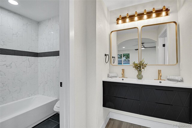 8357 Dudley Ct, Arvada, CO 80005 - full bathroom featuring double vanity, shower / washtub combination, recessed lighting, and tile patterned floors