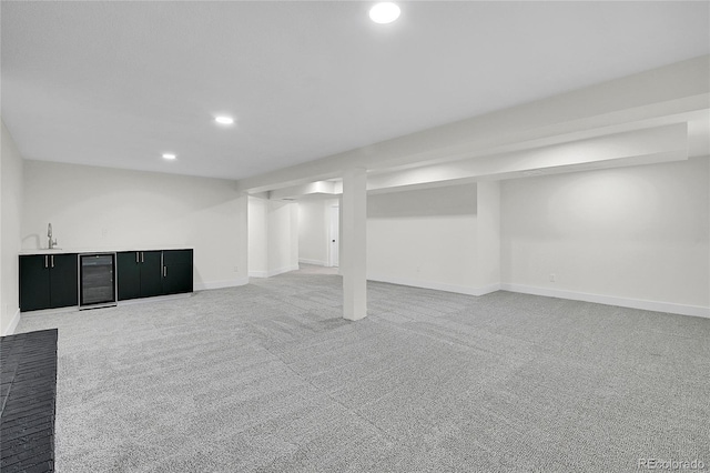 8357 Dudley Ct, Arvada, CO 80005 - finished below grade area featuring beverage cooler, recessed lighting, and light colored carpet
