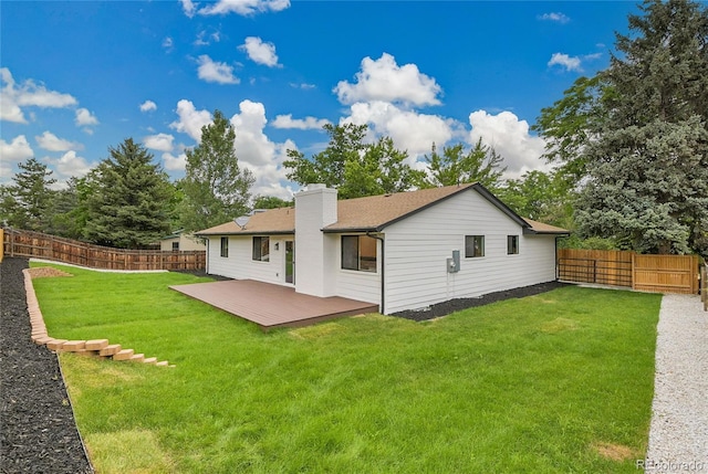 8357 Dudley Ct, Arvada, CO 80005 - rear view of property featuring a chimney, a fenced backyard, and a deck