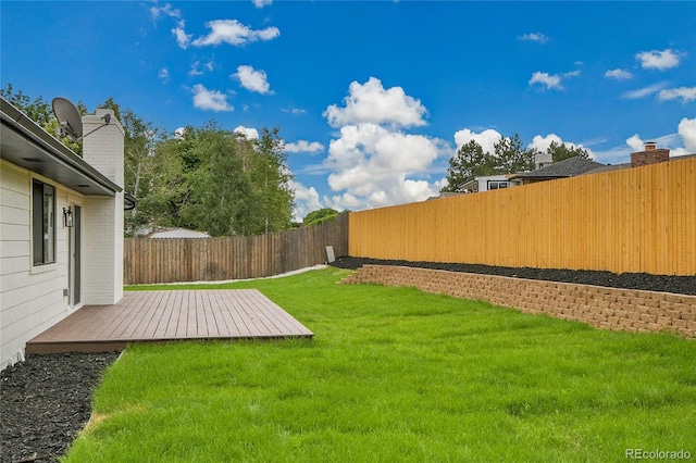 8357 Dudley Ct, Arvada, CO 80005 - fenced backyard featuring a wooden deck