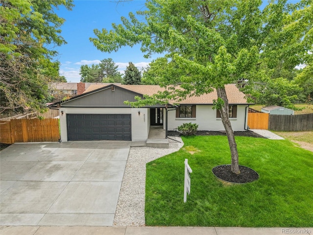 8357 Dudley Ct, Arvada, CO 80005 - ranch-style house featuring a garage, driveway, and a shingled roof